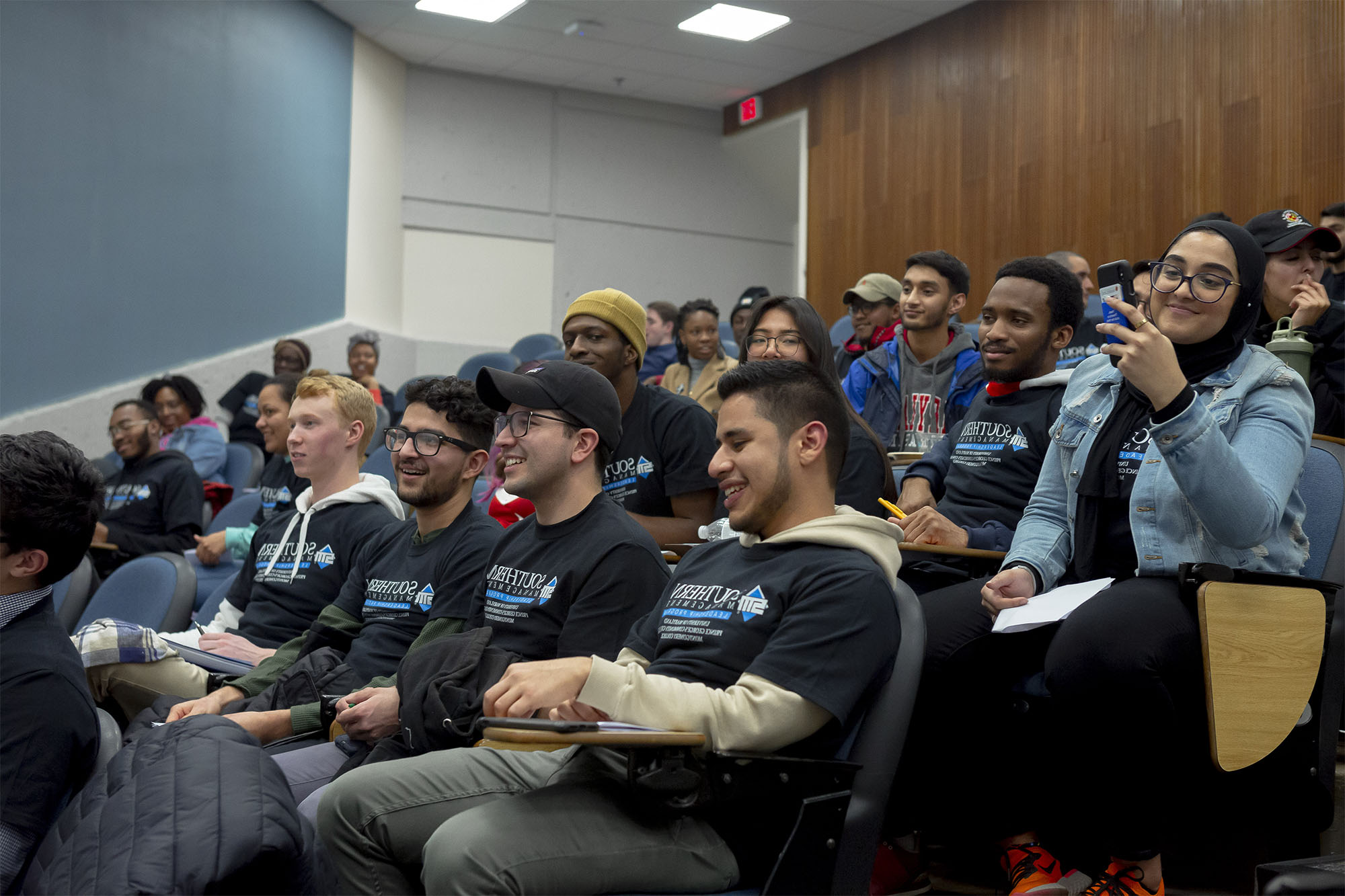 students sitting in an auditorium